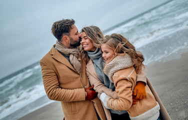 Fototapeta premium Family on the beach near the sea