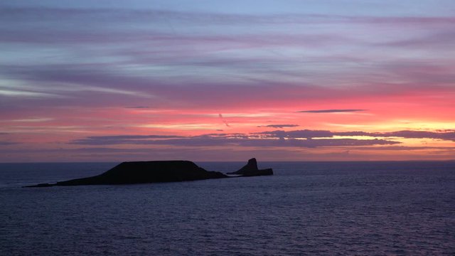 United Kingdom, South Wales, Gower peninsular, sunset over Worms Head
