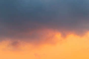 Grey cloud and orange sky.
