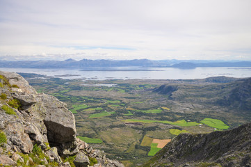 View to the Norwegian sea and Vega archipelago from a Gullsvågfjellet Mountain on Vega island, Norway on sunny summer day