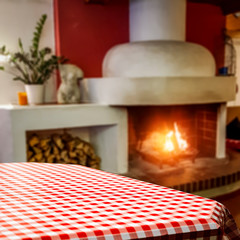 Desk of free space and home interior with fireplace 