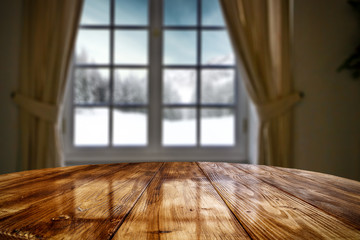 Desk of free space and winter window background 