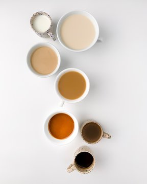 Different coffee beverages on white bacground