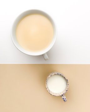Coffee and milk on white beige bacground on a concept picture