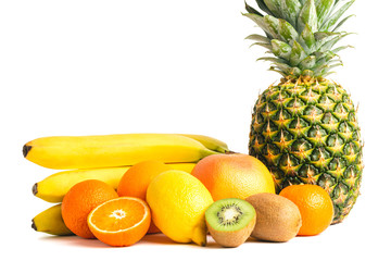 Assortment of tropical fruits, group of banana, kiwi, orange, tangerine, lemon, pineapple, grapefruit isolated on white background