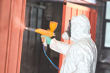 polymer coating of metal detail with powder spraying gun