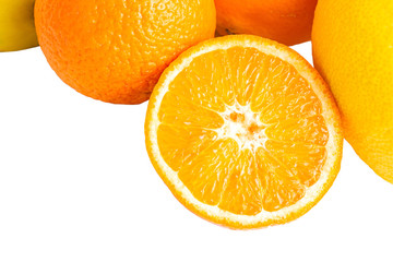 Group of tropical fruits, sliced orange halves isolated on white background