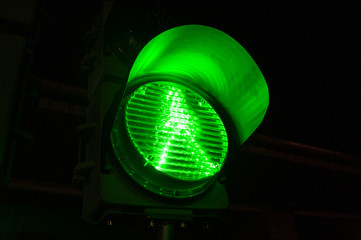 Green traffic light sign close up. Adjustment of vehicles with LED lamps.