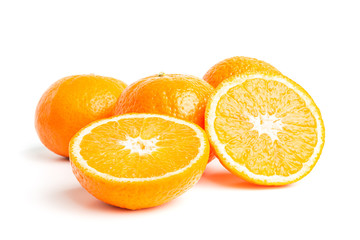 Sliced round halves of orange fruit and whole citrus isolated on white background