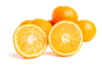 Sliced round halves of orange fruit and whole citrus isolated on white background