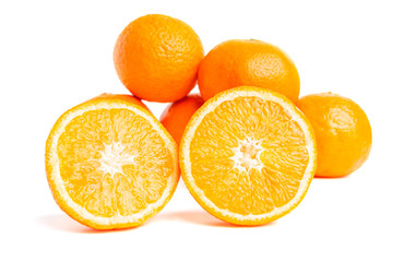 Sliced round halves of orange fruit and whole citrus isolated on white background