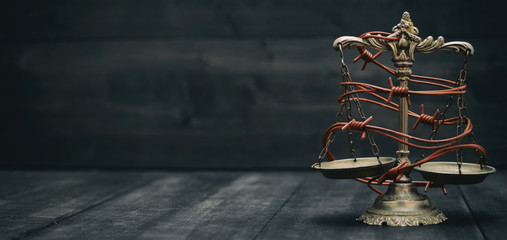 Scales of Justice and barbed wire, Compromised Rule of Law