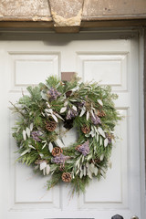 Fototapeta na wymiar Leaves and Fir Cones on Christmas Wreath