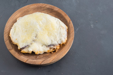 moussaka, eggplant of aubergine. Top view in black background