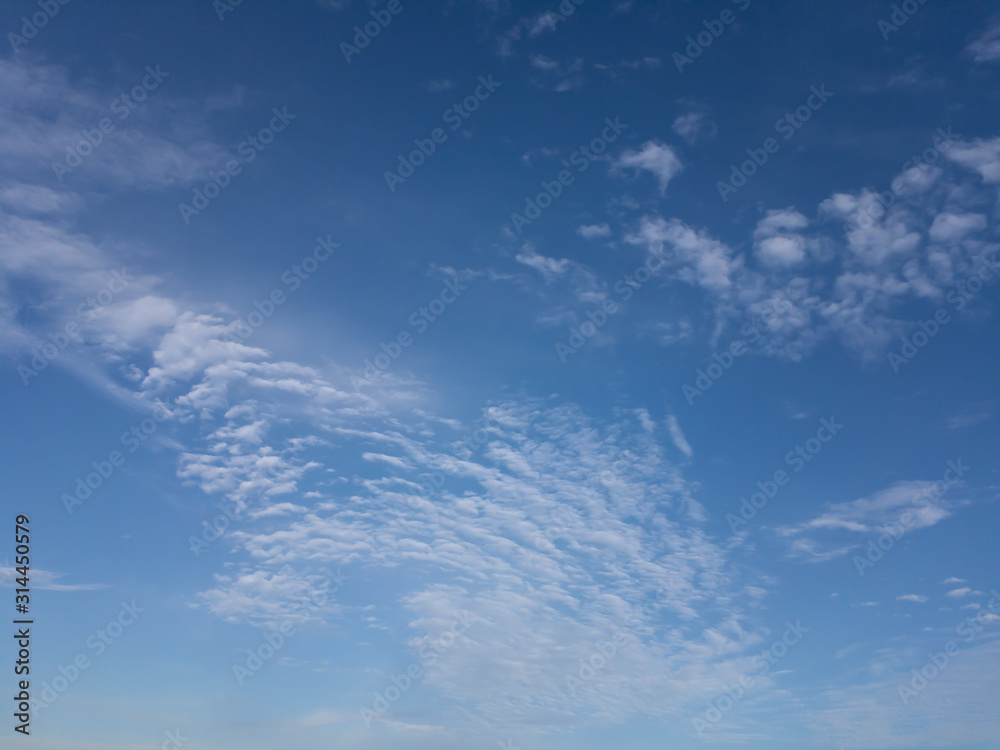 Wall mural blue sky with clouds