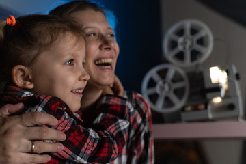 Mother and daughter watching old movie