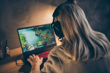 Close-up rear back behind view of her she nice skilled professional focused concentrated gray-haired blonde grandma playing VR game spending holiday at industrial loft modern concrete style interior © deagreez