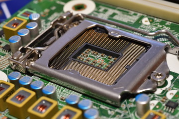 Detail of cpu socket on a modern computer motherboard. Electronic small component details.