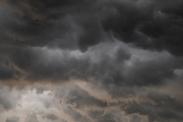Fototapeta na wymiar Storm cloud background before rain. Huge black clouds on sunset.
