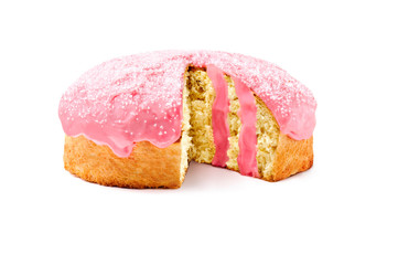 Colomba pasquale, an Italian traditional Easter cake, with strawberry icing and filling and sugar sprinkles on top. Read to use on a white backgroud.