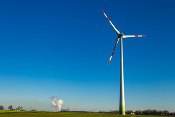 windmill in the foreground and incinerator in the background