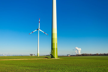 windmill in the foreground and incinerator in the background