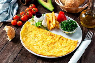 Omelette, dish made of beaten eggs served on the plate for breakfast or brunch
