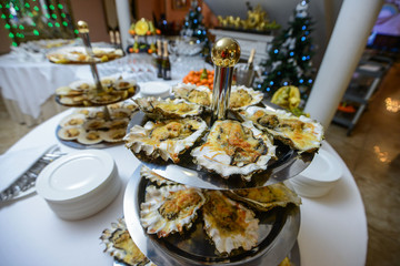 Fresh open oyster on a white plate. in the restaurant appetizer