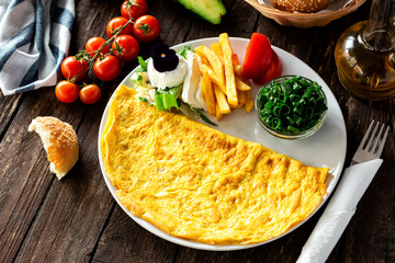 Omelette eggs with side dish decoration