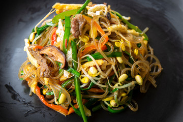 Stir fried Korean glass noodle with soy sauce called Japchae