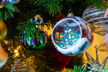 Christmas ball on a Christmas tree, colorful lights 