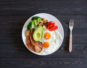 Ketogenic diet breakfast from above on brown table.