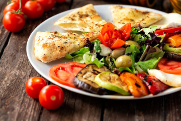 Yummy plant based food, grilled vegetables and fresh ones
