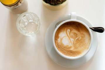 a cup of coffee on table