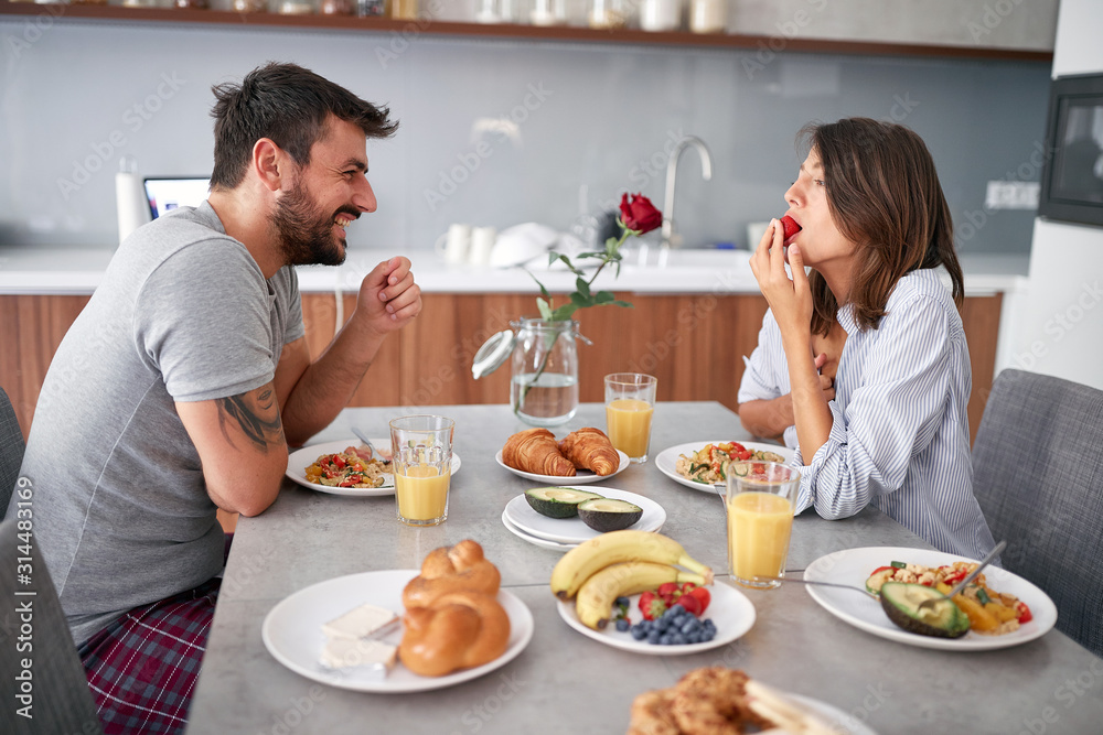 Wall mural happy couple breakfast in the morning celebratin valentines day . sexy and in love