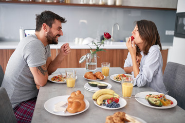 Obraz na płótnie Canvas happy couple breakfast in the morning celebratin valentines day . sexy and in love