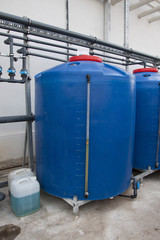 Auto watering system in the greenhouse. Large glass greenhouse. Growing vegetables in greenhouse conditions