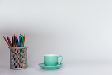 green cup and colored pencils mockup white background.