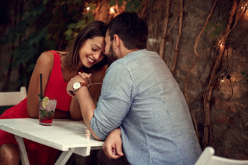 Couple hugging at bar and having date.Couple in love .