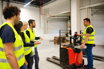 Training on a forklift, managers and workers	
