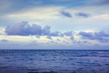 Caribbean sea and blue clouds sky. Travel background.