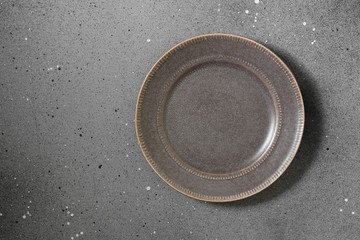 Grey plate on a grey background