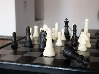 Chess board game with focus on black and white