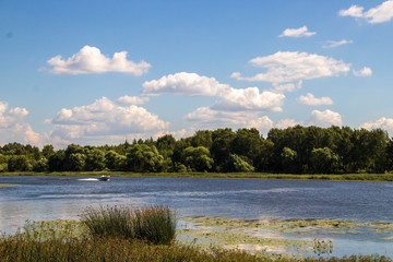 The Golden ring of Russia. Sunny summer day in Yaroslavl. Bank of the Kotorosl river. Boats on the river