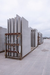 Picture of precast concrete walls ready for shipping in transport racks in panel stock