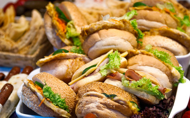 Hamburgers with ham, cheese and greens. Street food