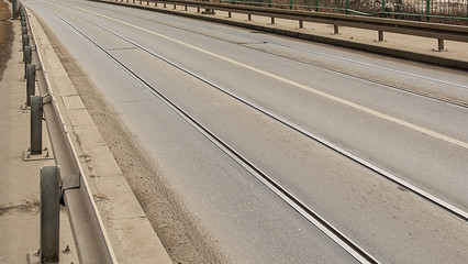 Tram tracks on the road leading across Sava bridge in Belgrade.