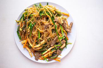 Stir fried Korean glass noodle with soy sauce called Japchae