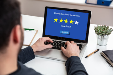 Man working with a computer, 4 stars, very good text on the screen, office background