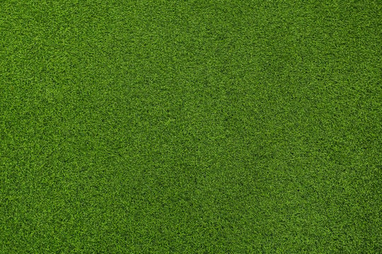 Seamless texture of artificial green grass made of plastic